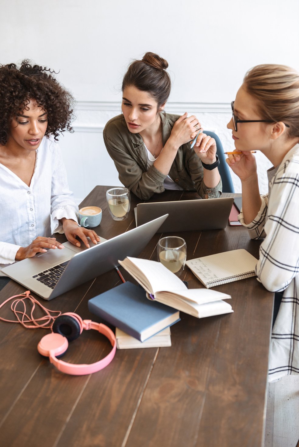 Group of Cheerful Young Women Studying Together